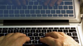 FILE - In this Feb. 27, 2013, file photo, hands type on a computer keyboard in Los Angeles. (AP Photo/Damian Dovarganes, File)