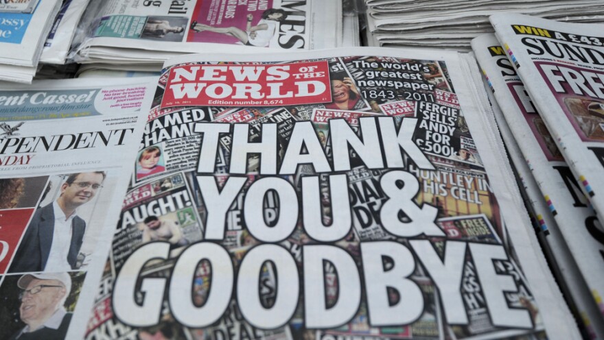 Copies of the last edition of the British tabloid newspaper, <em>News of the World,</em> sit in a London shop on Sunday.