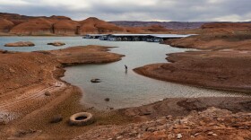 A fisherman tries his luck in the receding waters near Bullfrog Marina at Lake Powell on Friday, Saturday, April 24, 2026.