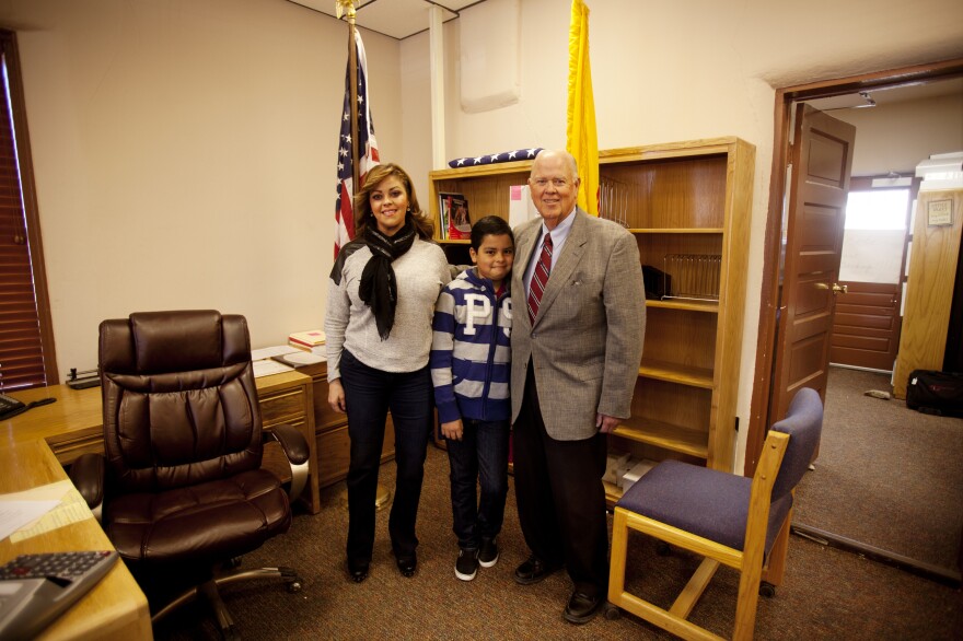 Phillip Skinner, former real estate developer and <em>maquiladora</em> owner-turned politician and school bus driver, stands with his wife, Diana, and son, Matthew, 10, moments after his mayoral inauguration.