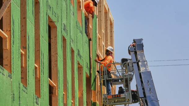 Workers are pictured at the construction site of a new apartment building in Lakewood, Ohio, Tuesday, July 15, 2025.