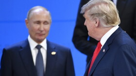 President Trump looks at Russia's President Vladimir Putin as they take their places for a photo during the G-20 summit in Buenos Aires, on Nov. 30, 2018. (Alexander Nemenov/AFP/Getty Images)