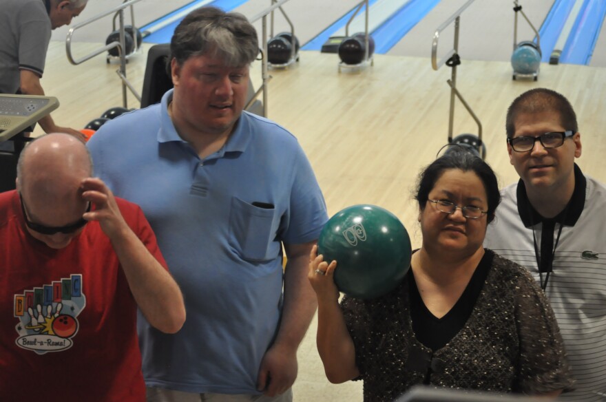 Four members of the Pinsplitters bowling league. 