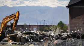 Workers dismantle the charred remains of a house at the location where an unrefined petroleum industry gas line leak explosion killed two people inside their home, in Firestone, Colo., Thursday, May 4, 2017. (Brennan Linsley/AP)