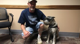 Curtis Harbour has trained his service dog Max to respond with love when Harbour feels stressed.
