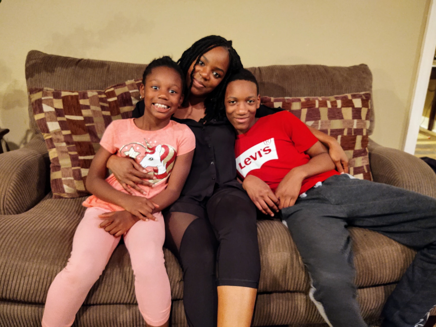 Shantrell Austin, center, with her children, Lauryn and Demiran.