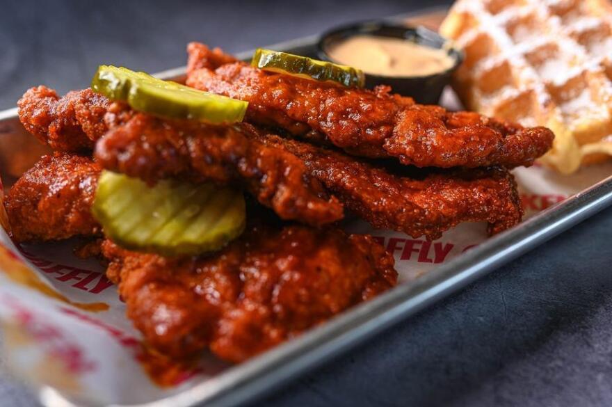 Fried chicken and pickles on a tray