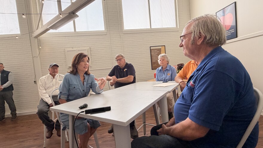 Gov. Kathy Hochul speaks with Jim Bittner, who owns an apple orchard in Niagara county, at the New York State Fair in Syracuse on Wednesday, August 26, 2026.