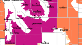 A map of Wyoming shows areas under an extreme heat warning. Most of the state is highlighted.