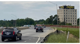You've probably seen the Varnadore Building -- a tall, beige cube with graffiti on top -- if you've ever driven on Independence Boulevard near uptown Charlotte.