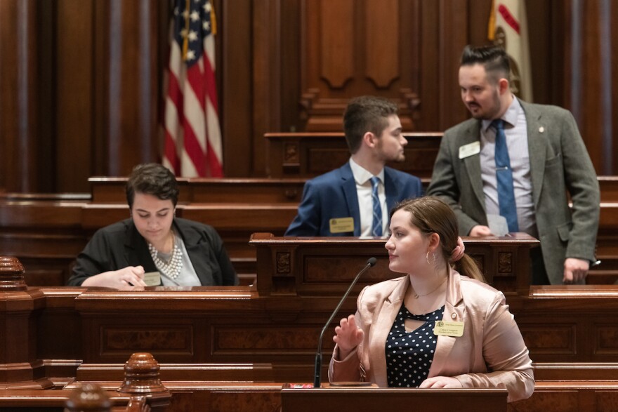 Model Illinois Government students in session at statehouse.