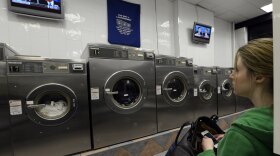 Watch the wash or watch the debate? This woman was at a laundromat in Manhattan during Monday's debate.