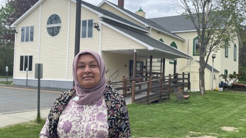 Dr. Mussarat Chaudhry in front of the original mosque building of the Islamic Center of the Capital District
