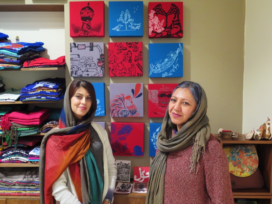 Sara Noghani (left) and Pooya Shahsiah are co-owners of a Tehran shop. Noghani is weighing an opportunity to reside in Australia but wants to give things in Iran a fair chance.
