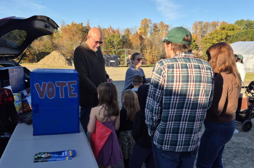 Democratic candidate for New York state Senate Devin Lander campaigns at a ‘Trunk or Treat’ event on Sunday, Oct. 18, 2026 in Rensselaer County, just outside Troy. Lander is vying to unseat incumbent Republican Sen. Jake Ashby.