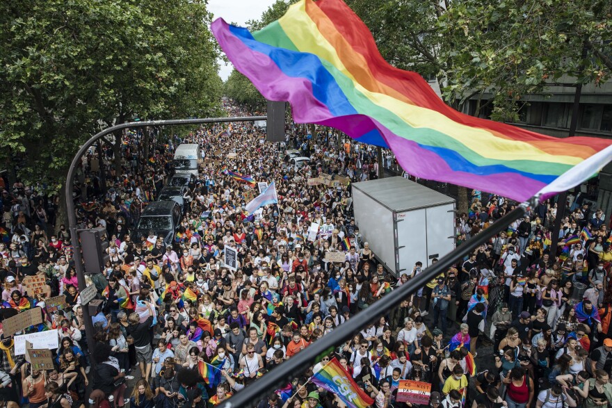 FILE - Crowds attend the annual Gay Pride march, June 26, 2021, in Paris.