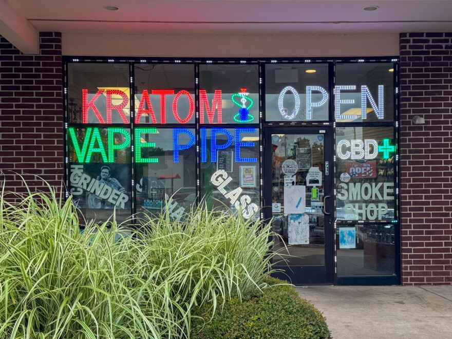 A smoke shop in Oklahoma City advertises kratom on its storefront windows.