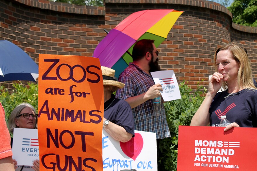 Moms Demand Actions protest guns in zoos as gun owners advocate for the right to carry firearms outside the Saint Louis Zoo on Saturday, June 13, 2015.