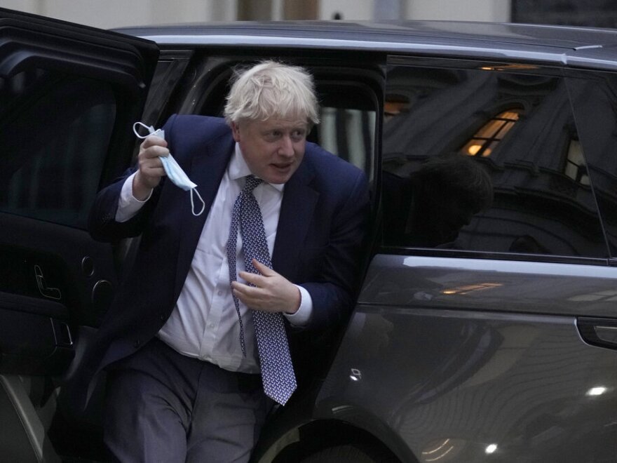 Britain's Prime Minister Boris Johnson arrives back at 10 Downing Street in London, Tuesday, Jan. 25, 2022.