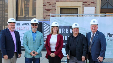 From left, Bloomington City Manager Jeff Jurgens, Urban Equity Properties Founder and CEO Justin Fern, Bloomington Director of Development Services Kelly Pfeifer, Urban Equity Properties COO and Corporate Counsel Jeff Orduno and Bloomington Mayor Dan Brady were among the stakeholders present for Monday's construction kickoff at the former State Farm building at 112 E. Washington St. The conversion project, now called G.J. Lofts, adds more than 180 luxury apartments, dining and retail along Washington and Jefferson Streets in Downtown Bloomington.