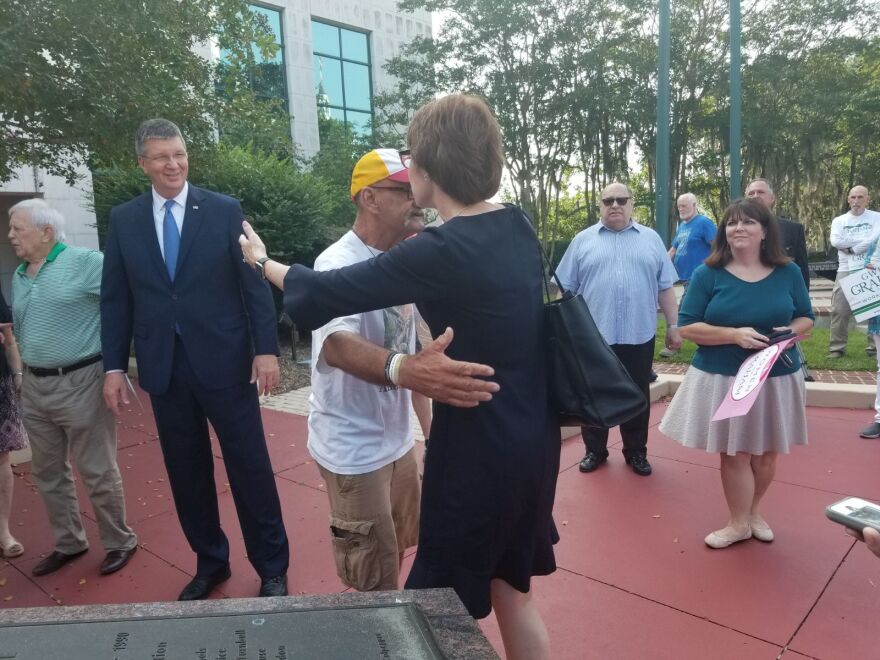 Graham greets supporters with hugs outside the Leon County Courthouse. She cast her ballot Thursday (8/23/18) before heading off for the rest of her campaign swing. 