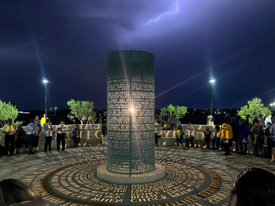 Lightning flashed in the sky as Odessans gathered around the Bright Star Memorial to remember the 2019 Odessa mass shooting.