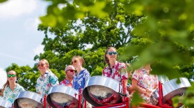 The Petoskey Steel Drum Band performs on its bus during the National Cherry Festival’s Cherry Royale Parade in 2025.