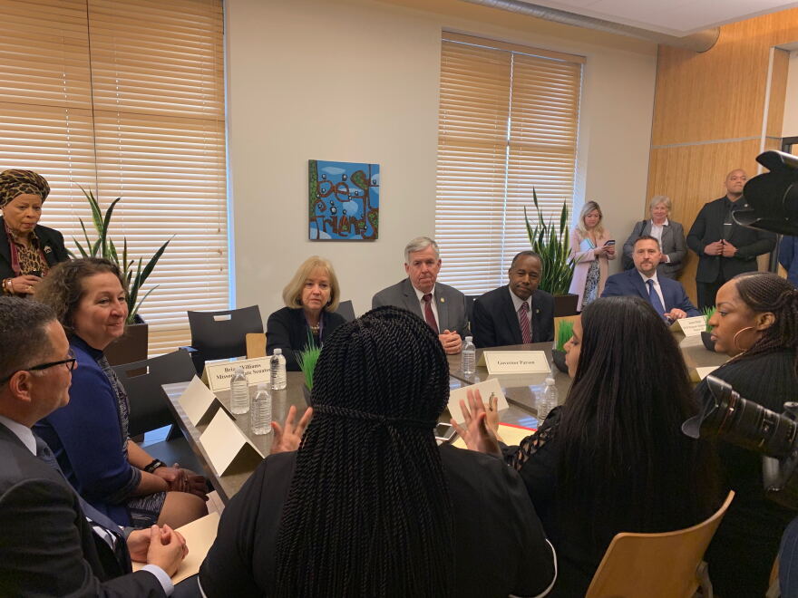 U.S. Department of Housing and Urban Development Secretary Ben Carson discusses St. Louis' Opportunity Zones with Mayor Lyda Krewson and Missouri Gov. Mike Parson.