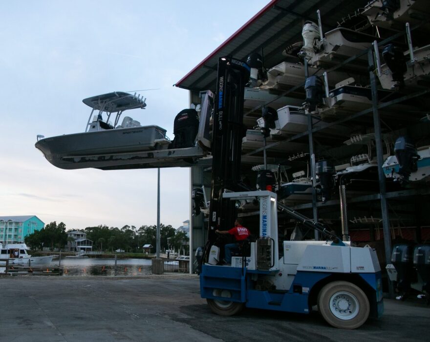 Workers at the Sea Hag Marina in Steinhatchee hastily prepare for Hurricane Matthew on Oct. 9, 2018. Hurricane Hermine in 2016 left several boats floating down the street after the marina flooded. (Cat Gloria/WUFT News)