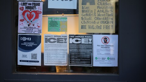 Signs on a Portland storefront on Wednesday, Jan. 28, 2026.