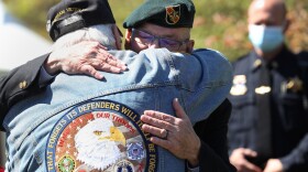 Medal of Honor recipient and Vietnam War veteran Gary Beikirch hugs a fellow veteran after a portion of Highland Park was dedicated as the Gary Beikirch Memorial Park on May 13, 2021.