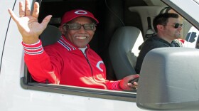 John Lomax waves from the WKRC-TV van in the 2014 Opening Day parade.