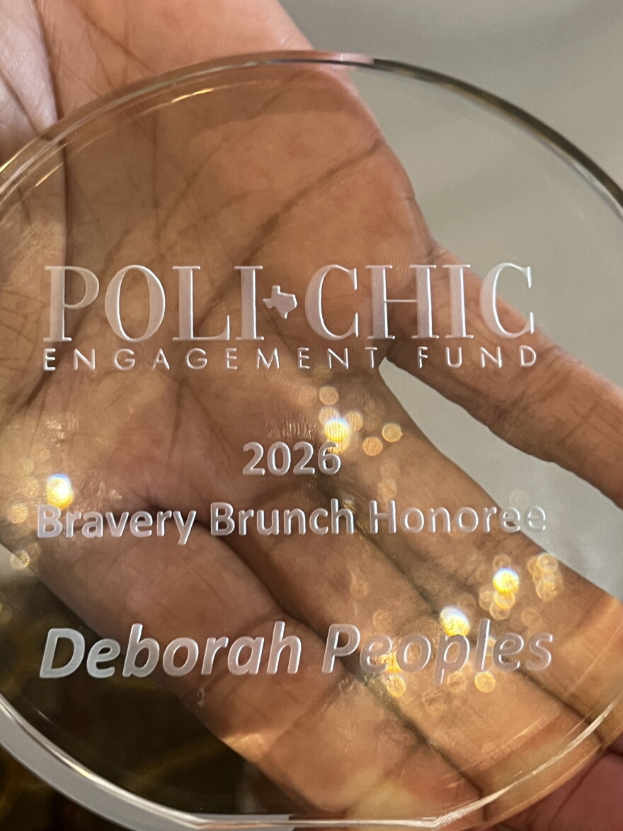 Recipient Deborah Peoples shows her award at the 2026 Bravery Brunch in San Antonio, hosted by Polihic Texas.