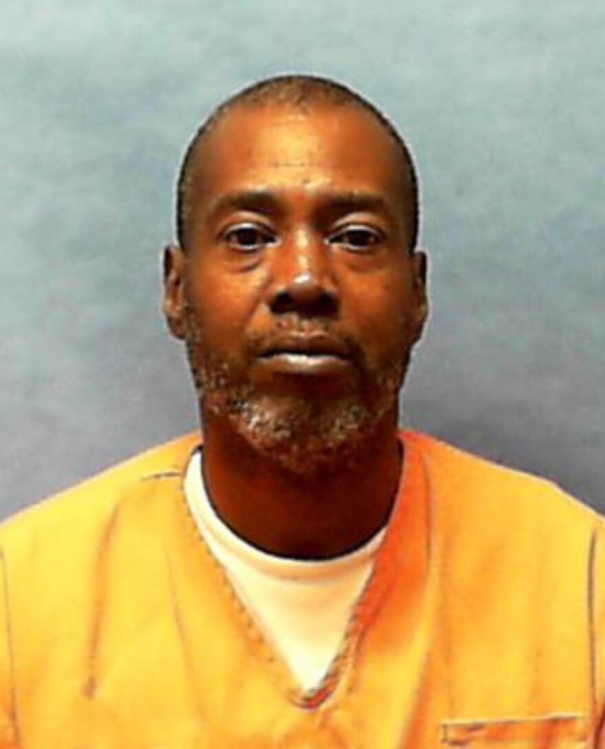African American man in jumpsuit for prison photo 