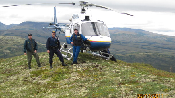 (From left) Alaska State Trooper pilot Mel Nading, trooper David Russel and Clint Johnson on Aug. 14, 2011, near McGrath, Alaska. Nading was killed in a helicopter accident shortly after the photo was taken.