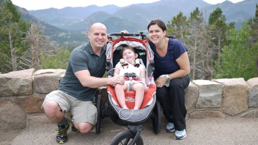 Adam, 37, Michaela, 3, and Kristy Frederick, 37, on a family hike in Colorado. The family moved to the state in 2013, in the hopes of treating Michaela's frequent seizures with an oil made from medical cannabis. 