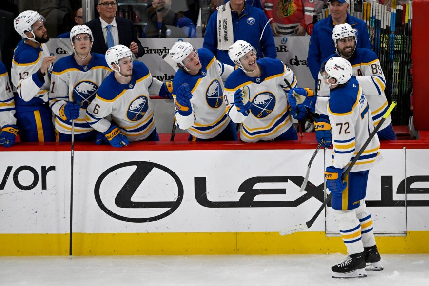 Buffalo Sabres' Tage Thompson (72) celebrates with teammates at the bench after scoring during the third period of an NHL hockey game against the Chicago Blackhawks in Chicago, Monday, April 13, 2026.
