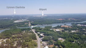 Aerial view shows Wilkinson Boulevard in downtown Belmont heading east toward the airport and uptown Charlotte. 