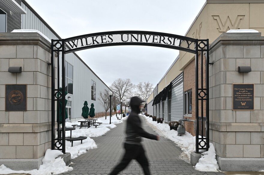 A man passes the arch at Wilkes University this week.
