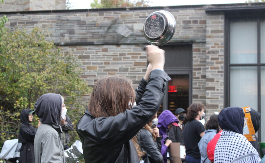 Protesters gathered in a courtyard outside the meeting of the Cornell Board of Trustees on Friday.