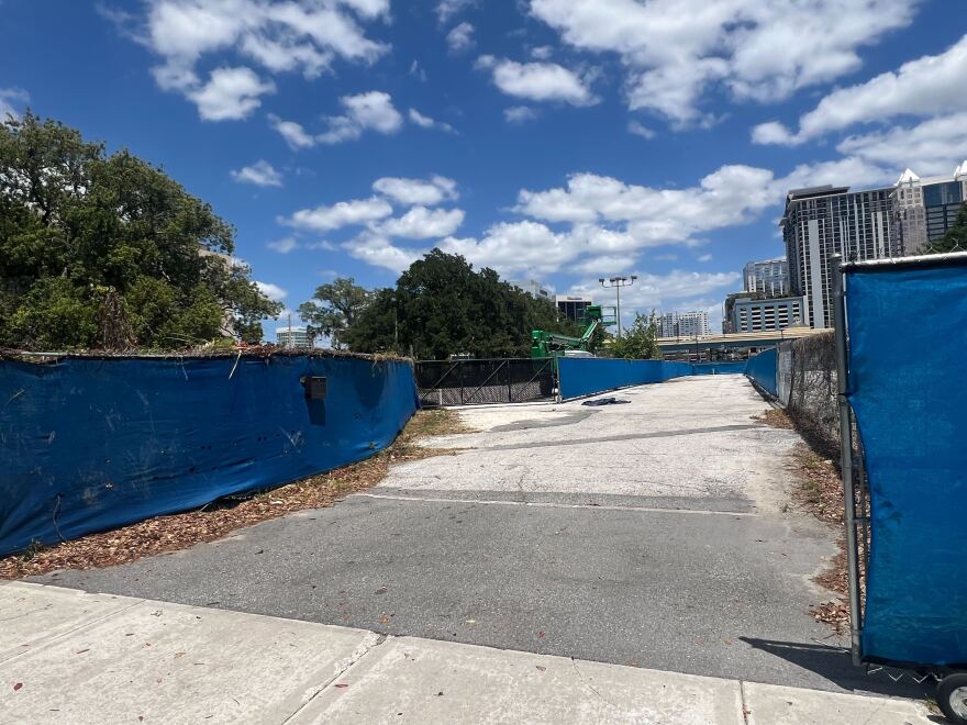 The area designated for Westcourt is fenced and covered with a blue tarp in Downtown Orlando.