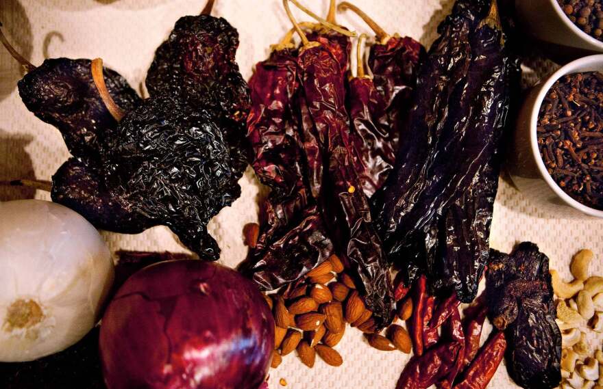 The main ingredient in mole is dried chili peppers; to prepare them for cooking, one must remove the seeds, toast the seeds with tortillas, then rinse the seeds, then roast the skins, rehydrate them and finally blend and cook them together with all the other ingredients.