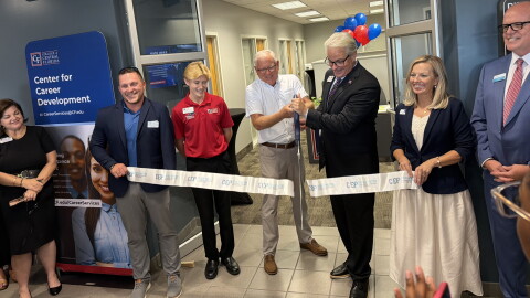 James Henningsen (third from right)President of the College of Central Florida and 2025-2026 Board of Trustees member Rusty Branson cutting the ribbon, officially opening the new Center for Career Development at the CF Ocala Campus Enterprise Center. (Jake Hoffman/WUFT News)