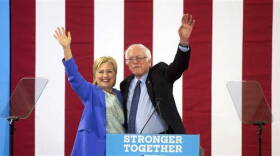 Democratic presidential candidate Hillary Clinton and Sen. Bernie Sanders, I-Vt., wave during a rally in Portsmouth, N.H., Tuesday, July 12, 2016, where Sanders endorsed her for president..