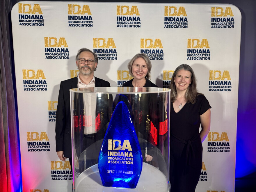Eric Weddle, Sarah Neal Estes and Kyle Travers pose with Indiana Broadcasters Association Spectrum Award.