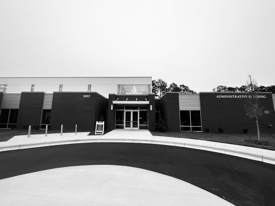 The Healing Place of New Hanover County. A sign outside advertises NA/AA meetings — the facilities primary form of drug and alcohol service.