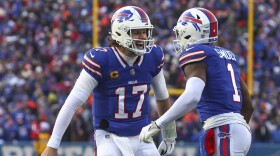 Buffalo Bills quarterback Josh Allen (17) celebrates with wide receiver Curtis Samuel (1) after Samuel scored a touchdown against the Denver Broncos during the fourth quarter of an NFL wild card playoff football game, Sunday, Jan. 12, 2025, in Orchard Park, N.Y. (AP Photo/Jeffrey T. Barnes)