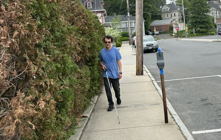  Author Andrew Leland walks down a street in Northampton, Massachusetts, June 12, 2023.