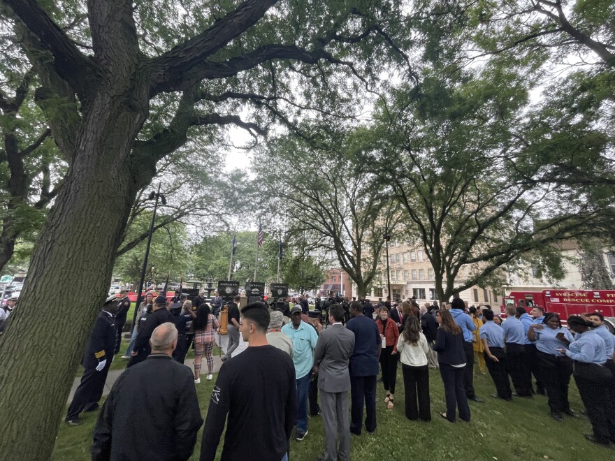 People standing next to trees in a park 