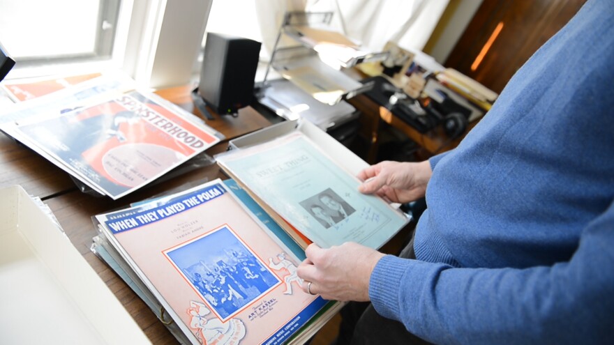 Case Western Reserve University music professor Daniel Goldmark shows off his collection of Cleveland sheet music [photo: ideastream]